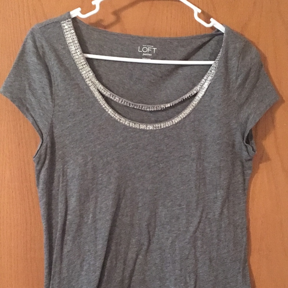 Adorable blouse with detailing around neckline.